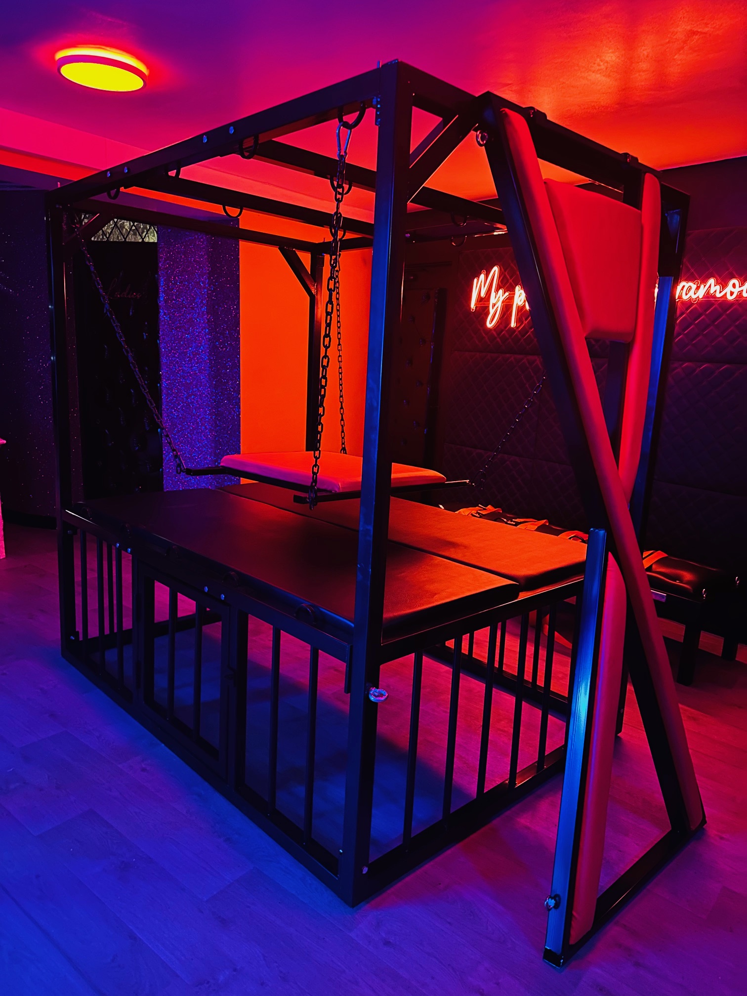 The Black & Orange room at Maxwell Manor, lit in neon for a shoot